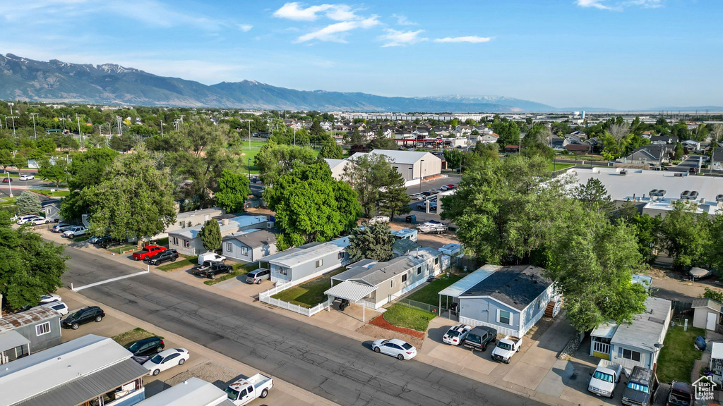 Aerial view of residential area featuring a mountainous background