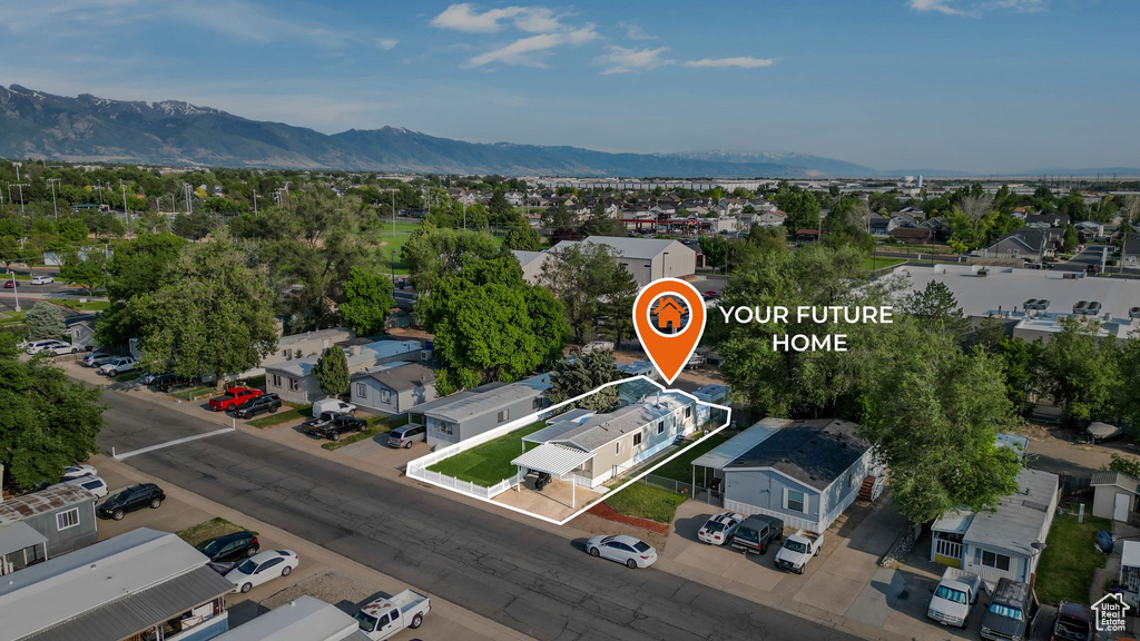 Aerial view of residential area featuring a mountain backdrop