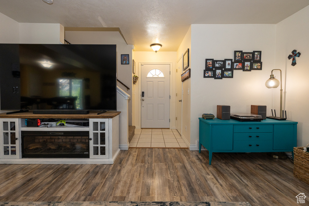 Entryway with wood finished floors and baseboards
