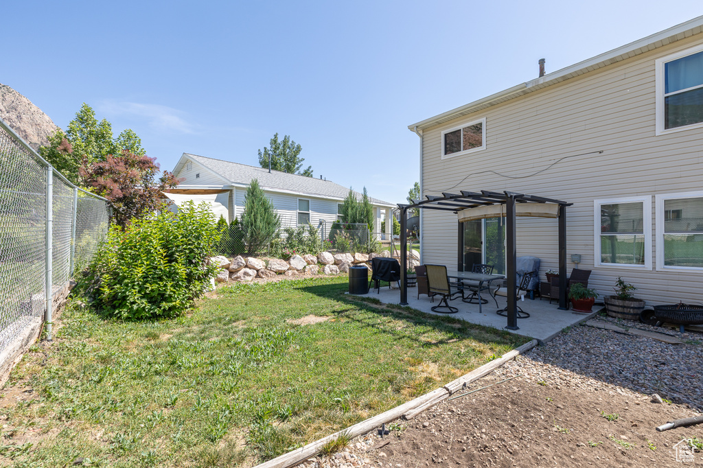 View of yard featuring a pergola and a patio area