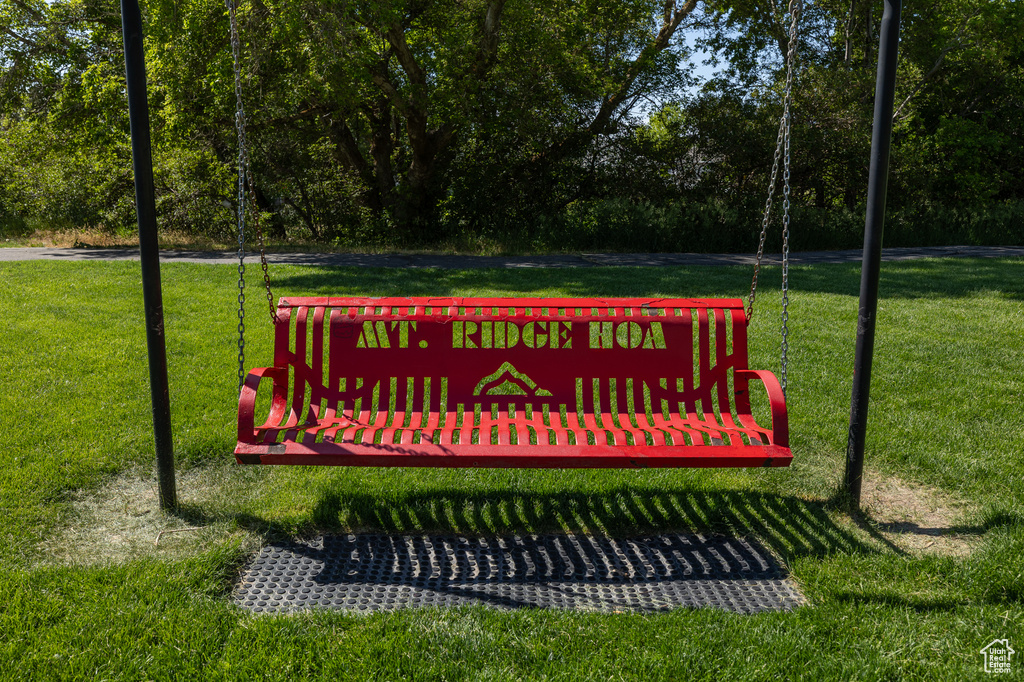 Community / neighborhood sign featuring a yard
