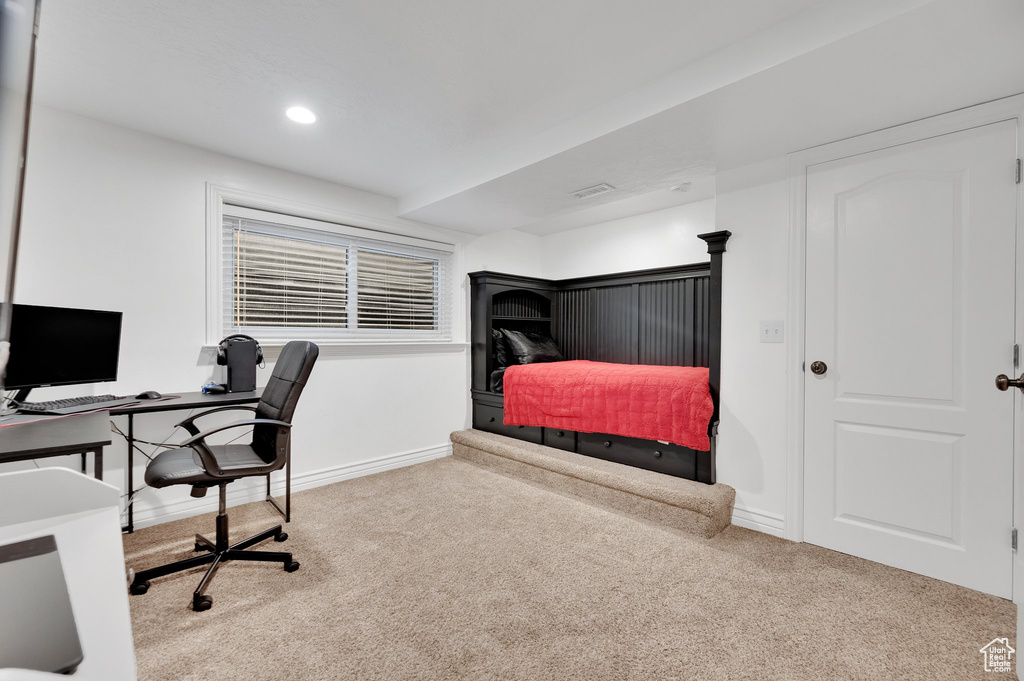 Bedroom featuring carpet floors, baseboards, an office area, and recessed lighting