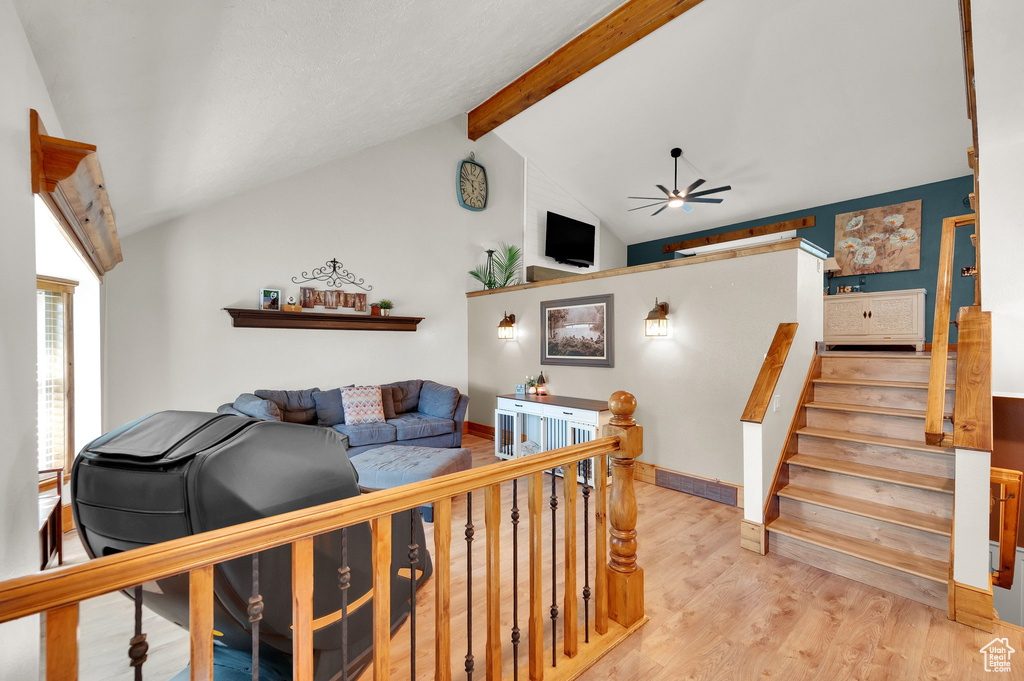 Living area featuring a ceiling fan and wood finished floors