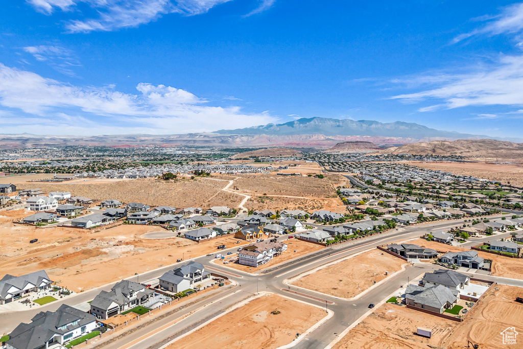 Aerial view of residential area featuring a mountainous background