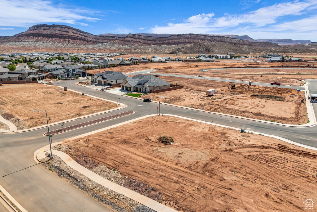 Aerial perspective of suburban area with a mountain backdrop
