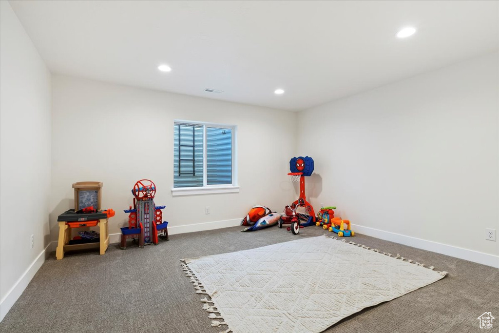 Game room with carpet floors, baseboards, and recessed lighting