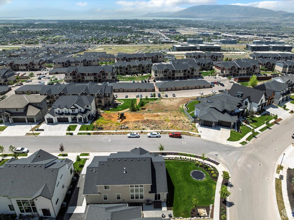 Aerial perspective of suburban area featuring a mountainous background