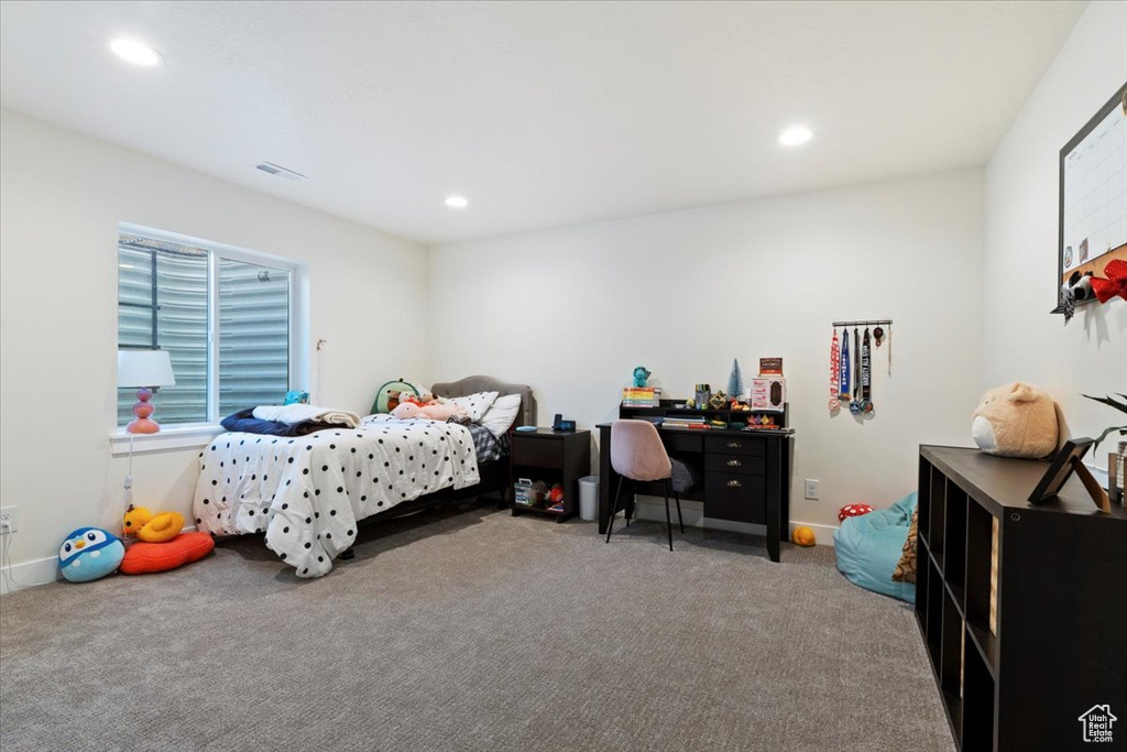 Carpeted bedroom featuring recessed lighting and baseboards