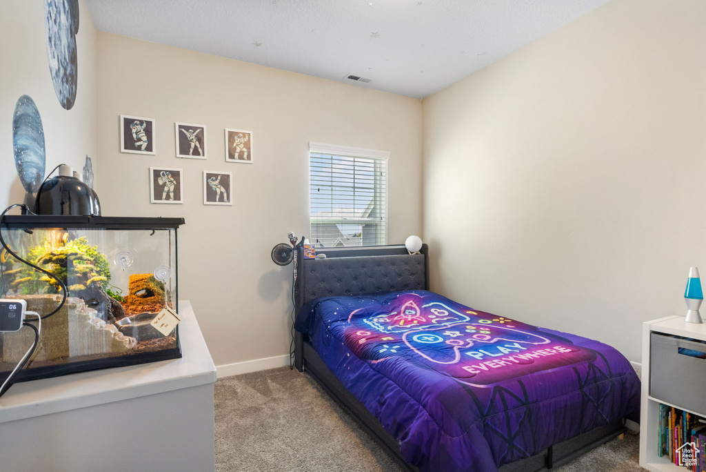 Bedroom with carpet and baseboards