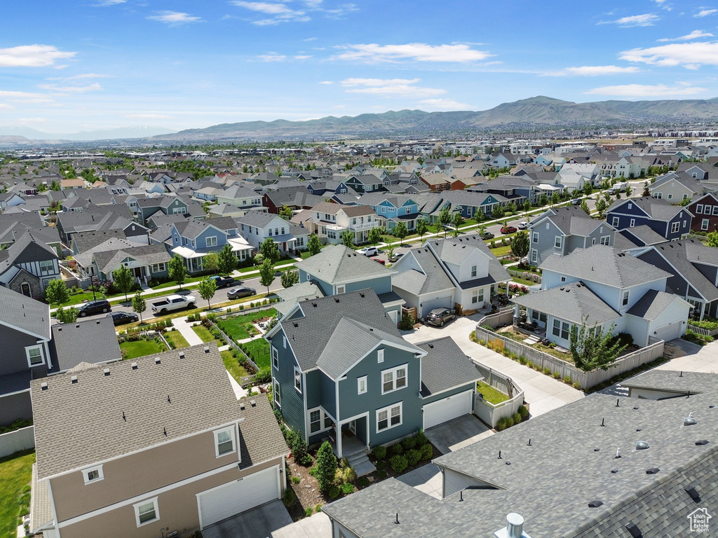 Aerial perspective of suburban area with a mountainous background