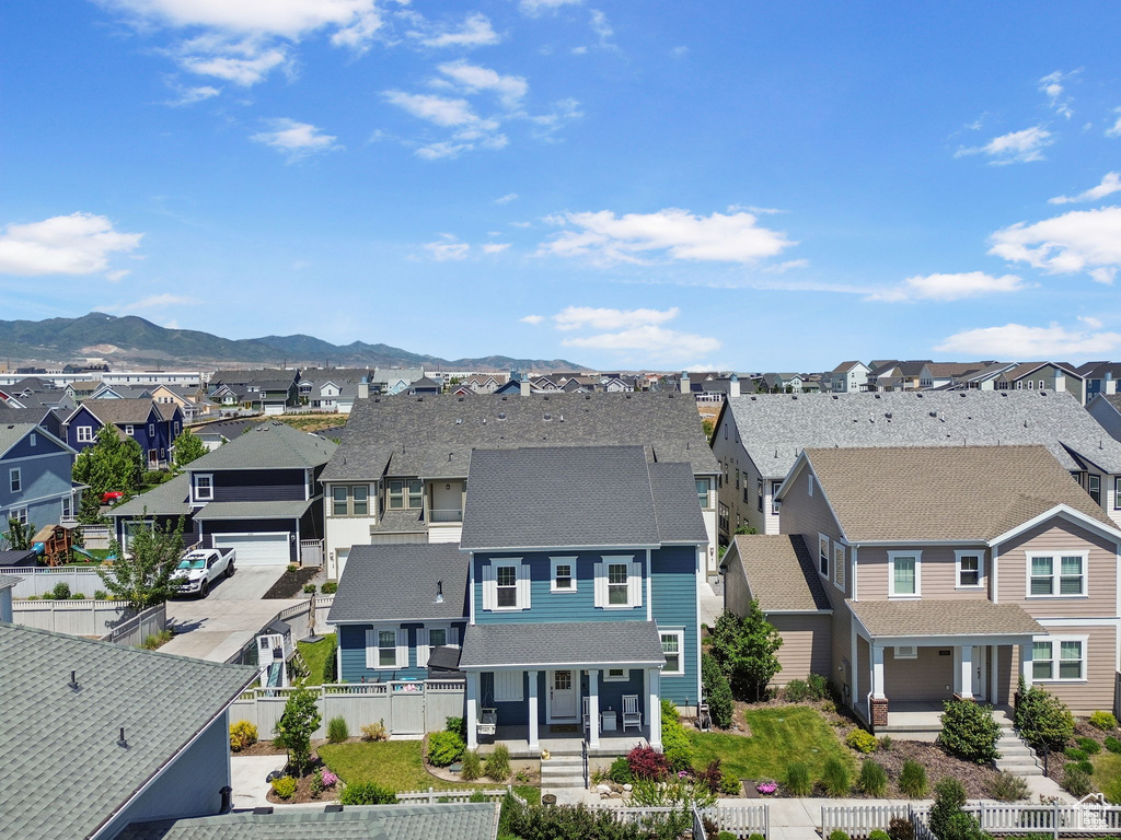 Aerial perspective of suburban area featuring a mountainous background