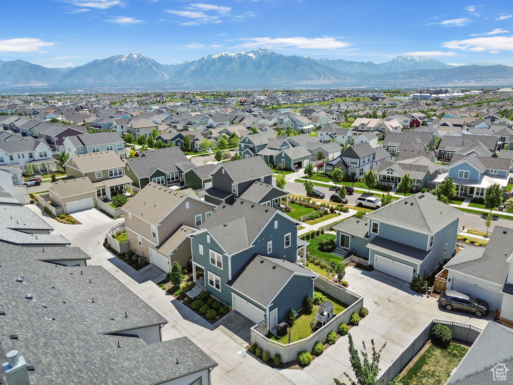 Aerial view of residential area featuring a mountain backdrop