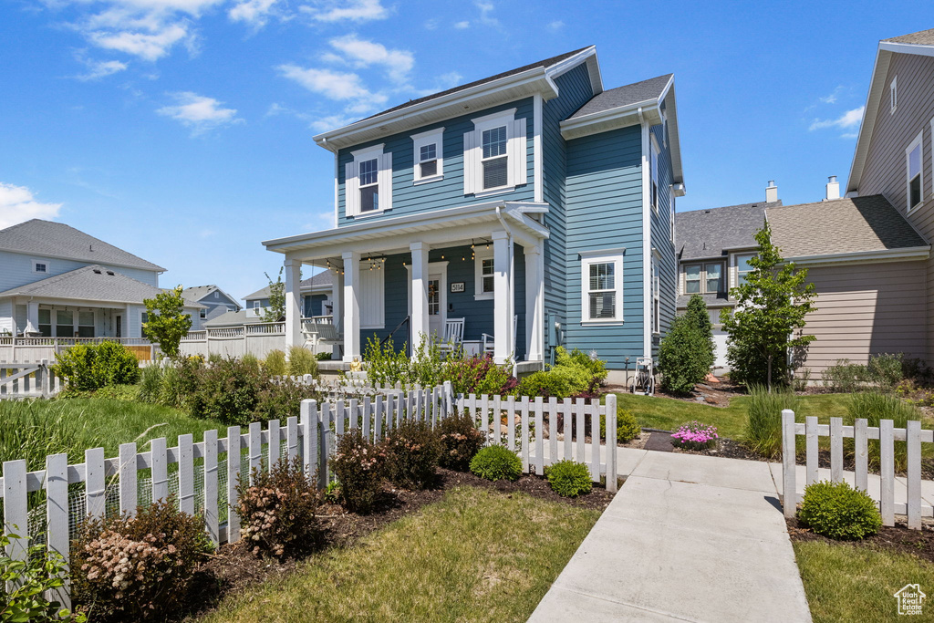 View of front of home with covered porch and a residential view