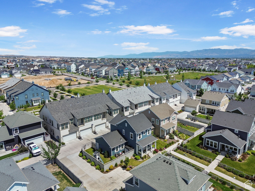 Aerial perspective of suburban area featuring a mountain backdrop