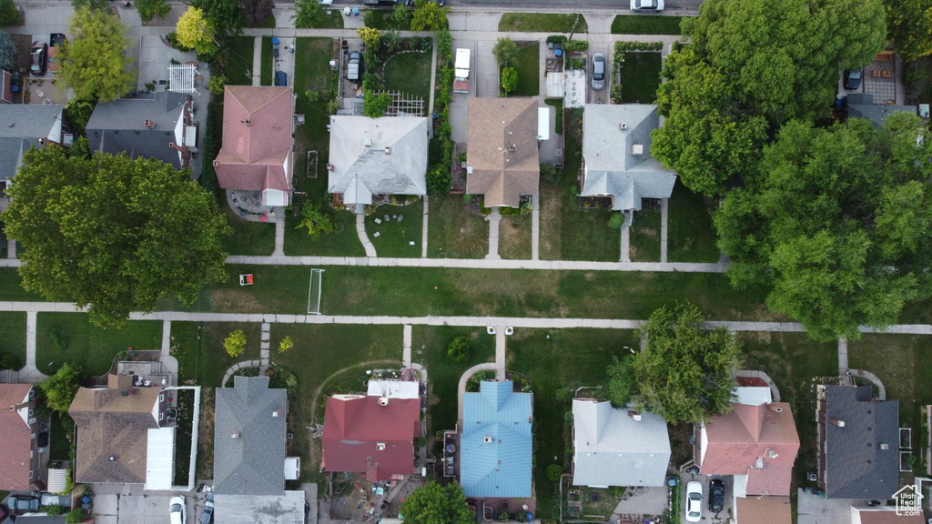 Aerial view of property and surrounding area with nearby suburban area