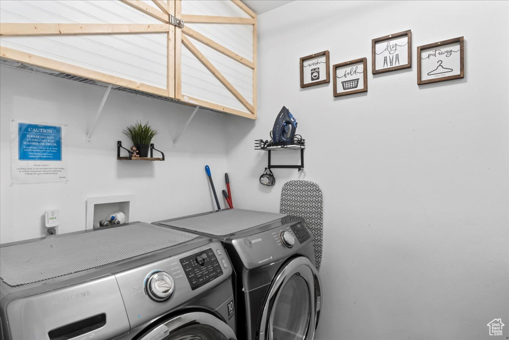 Laundry room featuring independent washer and dryer