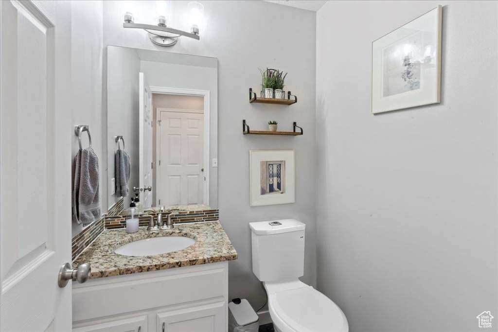 Bathroom with vanity and toilet