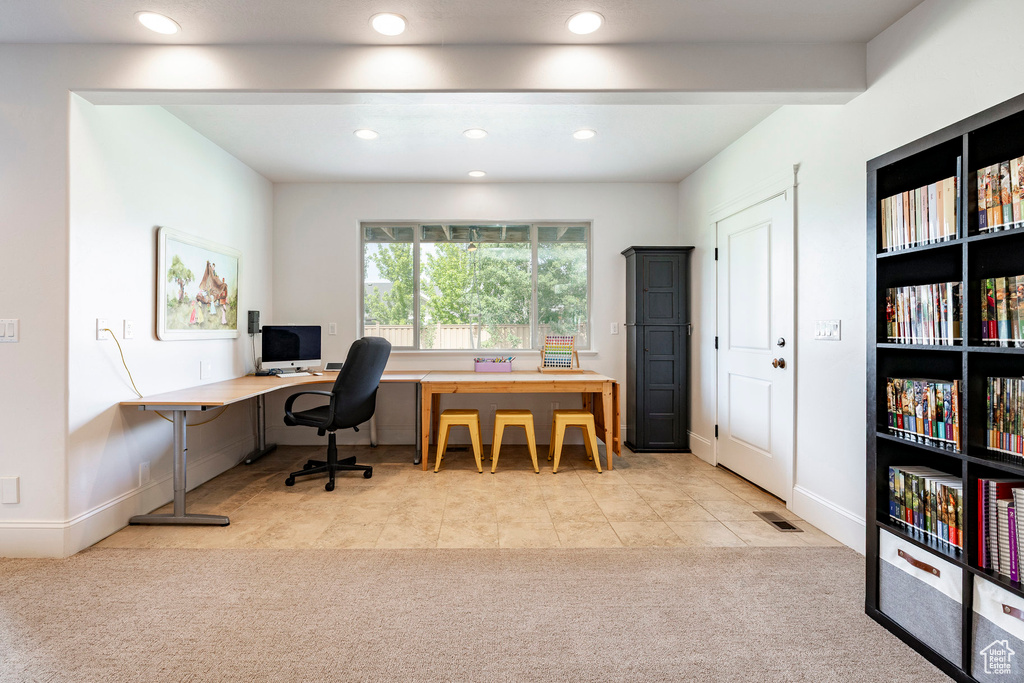 Office area featuring carpet, recessed lighting, baseboards, and tile patterned flooring