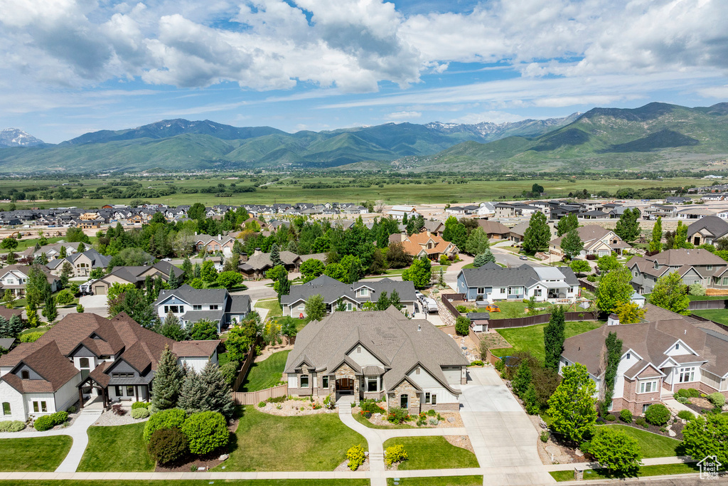 Aerial view of residential area with a mountainous background