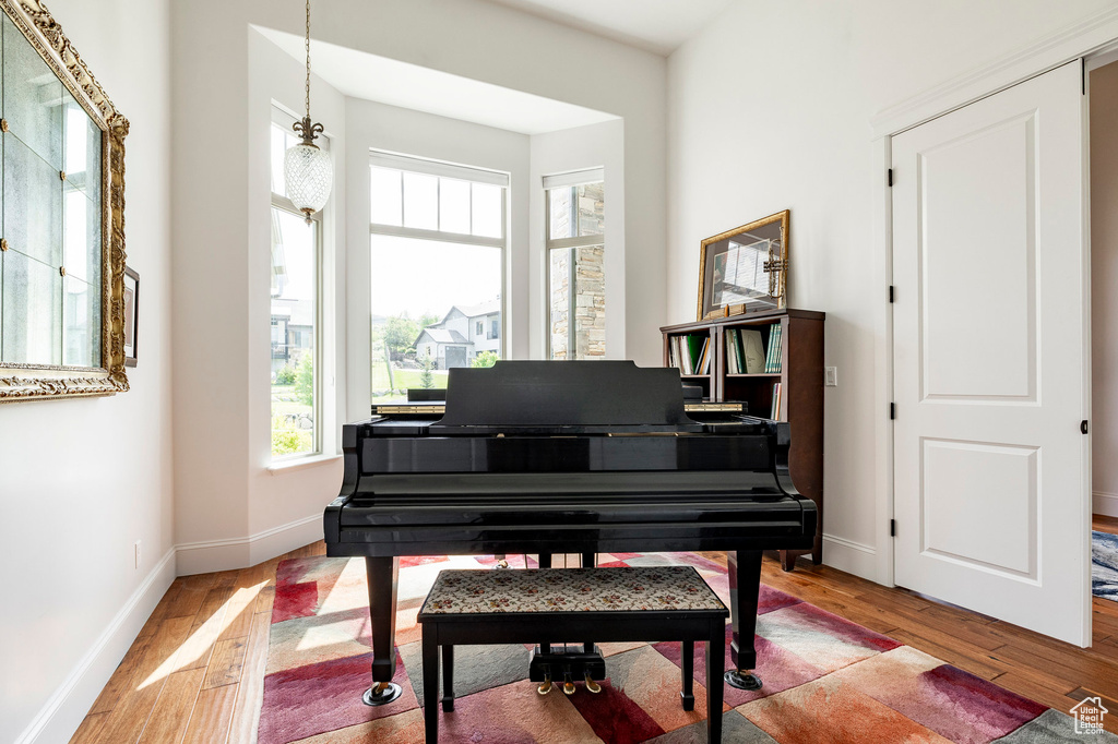 Sitting room with wood finished floors and baseboards