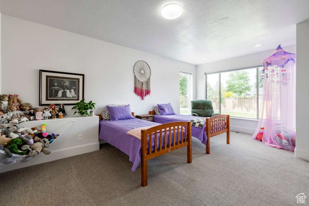 Carpeted bedroom with baseboards