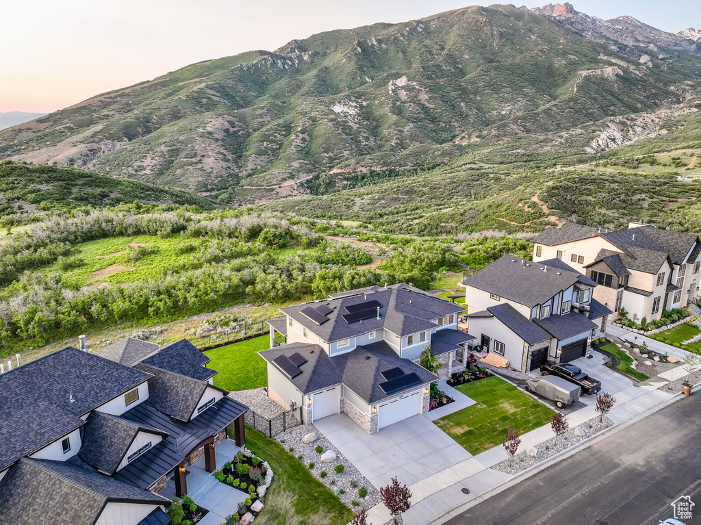 Aerial perspective of suburban area featuring a mountainous background