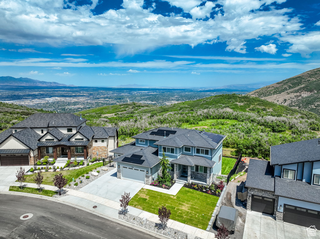 Aerial perspective of suburban area with a mountain backdrop