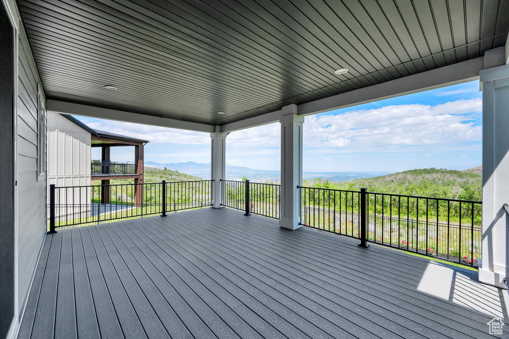 Wooden terrace featuring a mountain view
