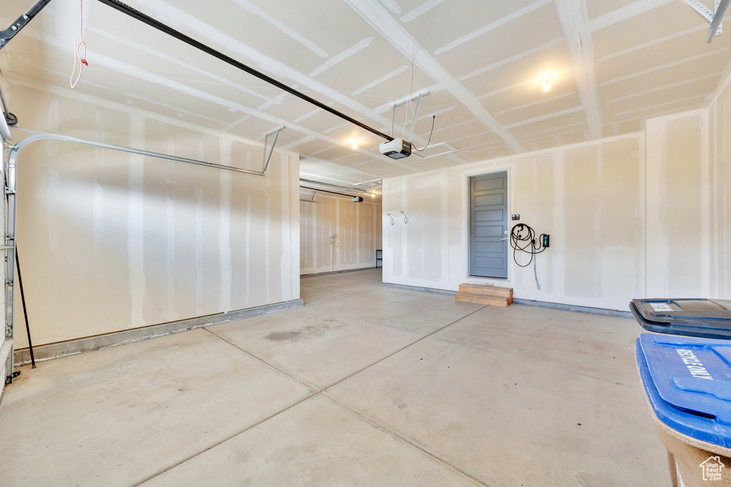 Garage featuring a garage door opener