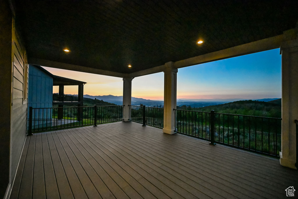 Wooden terrace featuring a mountain view