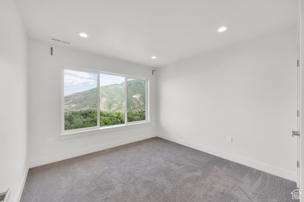 Unfurnished room featuring recessed lighting, baseboards, and carpet floors