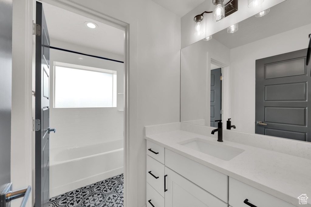 Full bath featuring vanity, shower / washtub combination, and recessed lighting