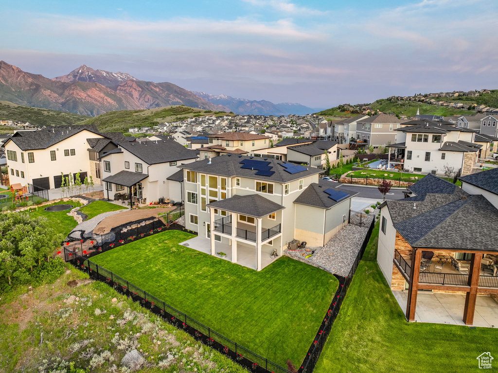 Aerial view of residential area featuring a mountainous background