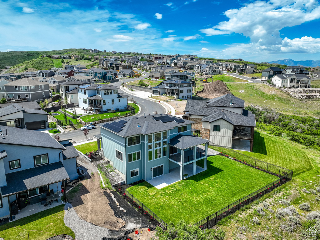 Aerial perspective of suburban area featuring a mountainous background
