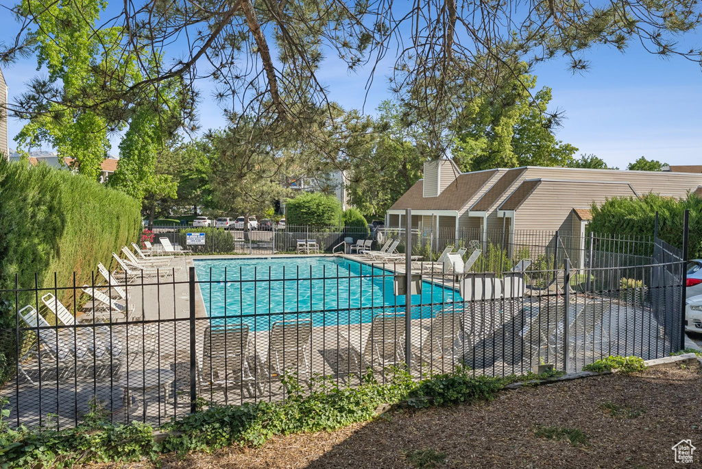 Community pool with a patio