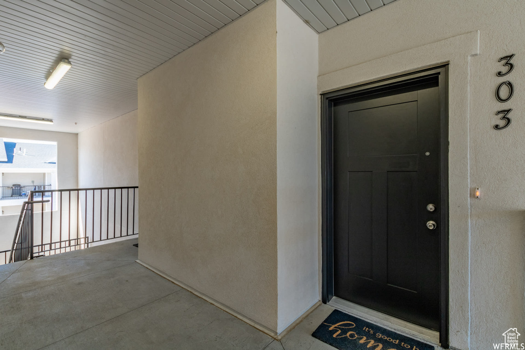 Property entrance with stucco siding