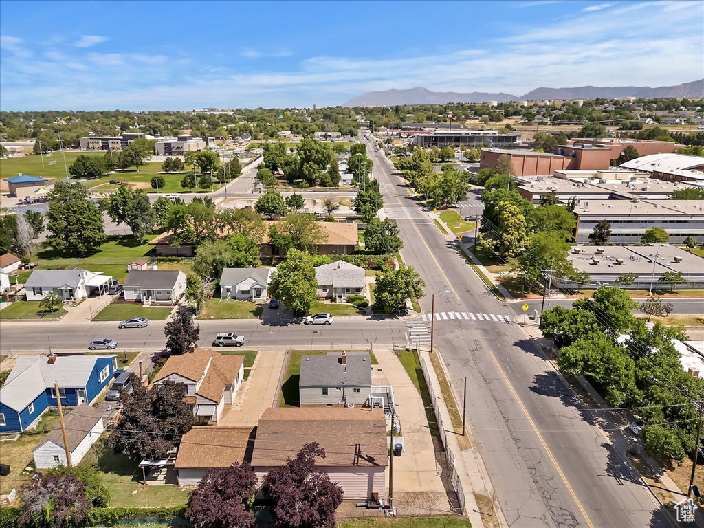 Aerial view of residential area featuring a mountainous background