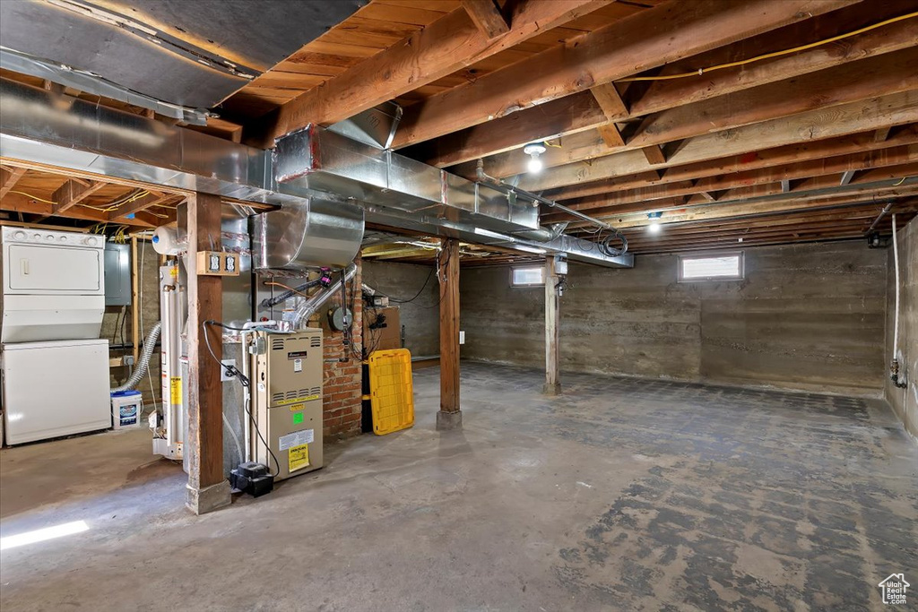 Basement featuring heating unit and gas water heater