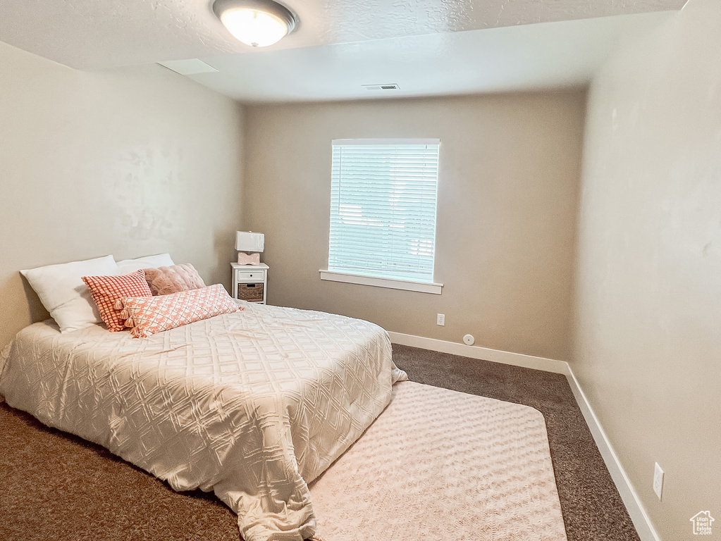 Bedroom with carpet and baseboards