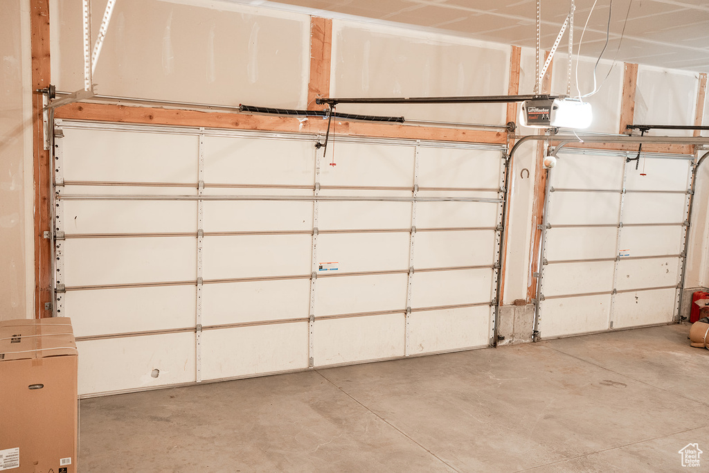 Garage featuring a garage door opener