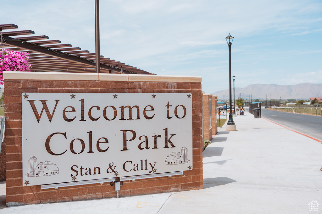 Community sign with a mountain view