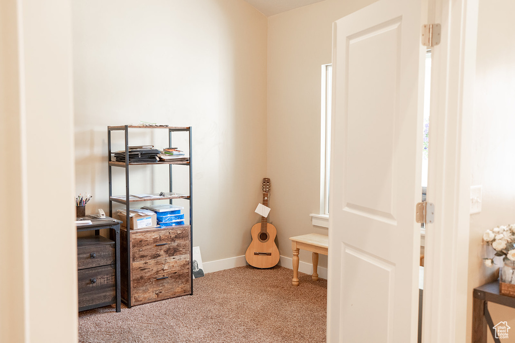 Bedroom with carpet and baseboards