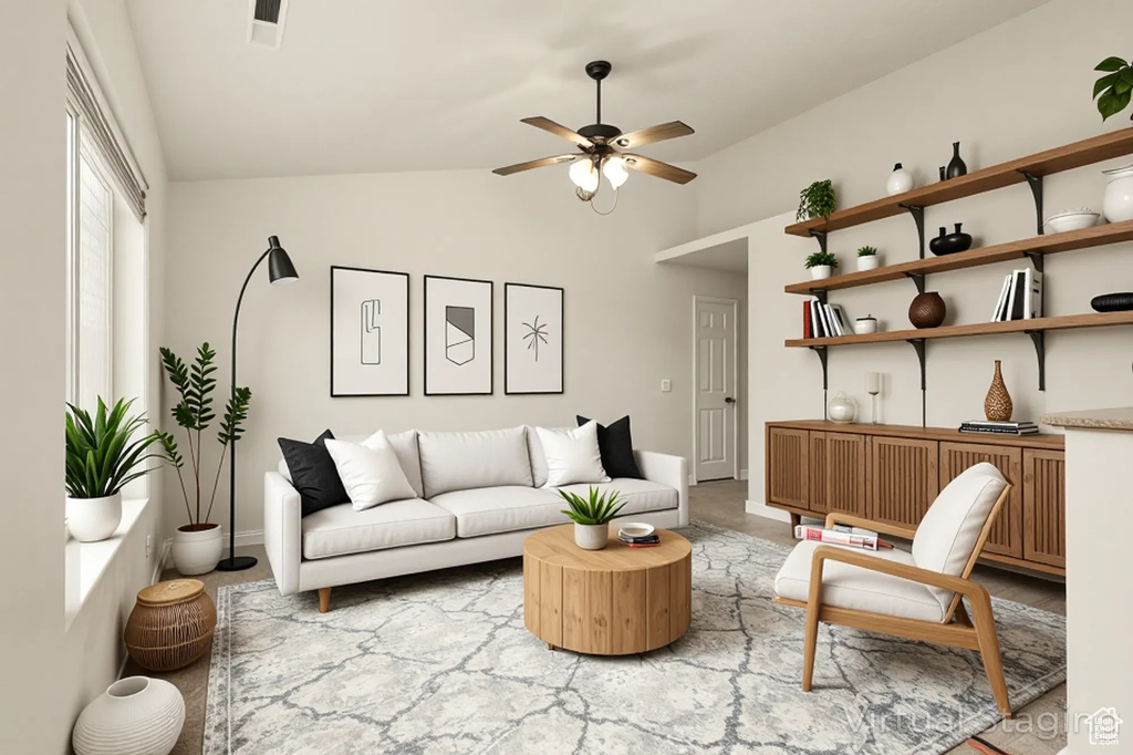 Living area featuring ceiling fan, baseboards, and high vaulted ceiling