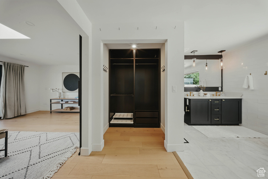 Hall featuring light wood-style floors