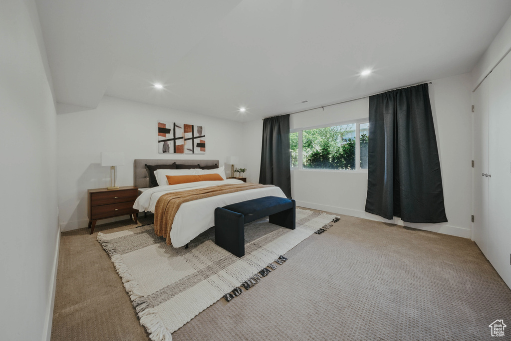 Bedroom featuring recessed lighting, light colored carpet, and baseboards