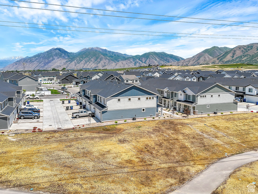 View of mountain backdrop featuring nearby suburban area