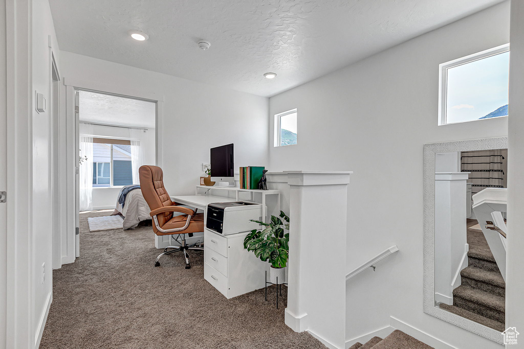 Carpeted home office featuring recessed lighting and baseboards