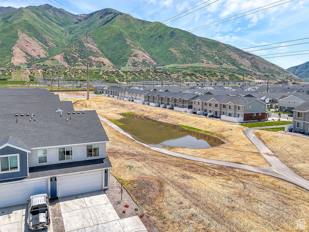 View of mountain backdrop featuring nearby suburban area