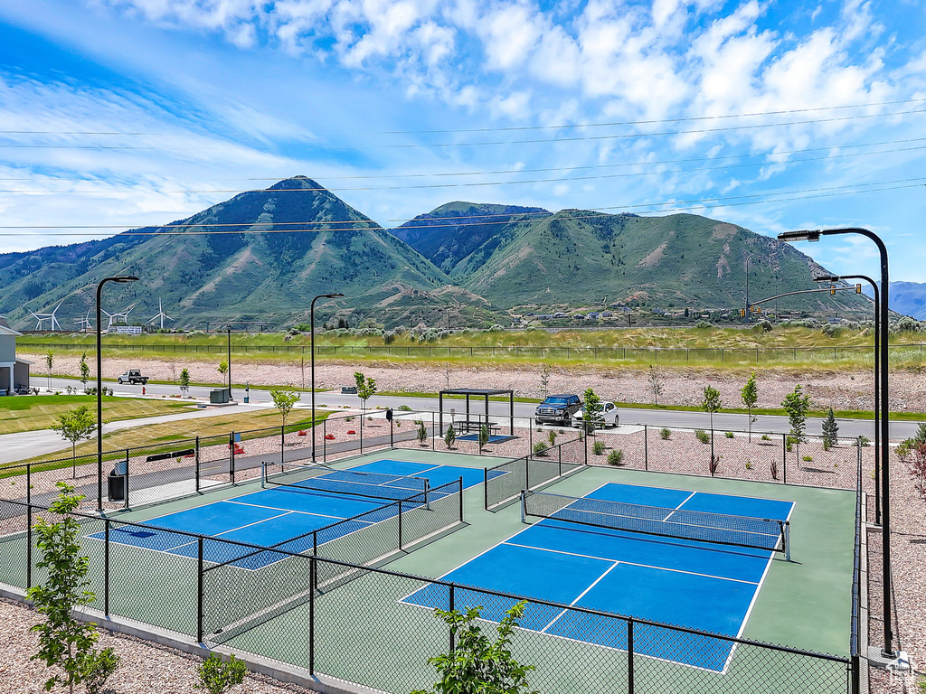 View of tennis court featuring a mountain view