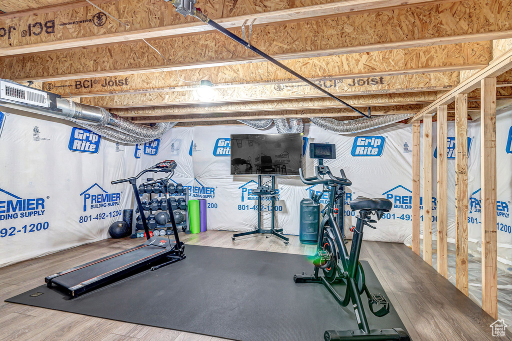 Workout room with wood finished floors